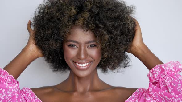 Smiling Black Woman with Curly Hair