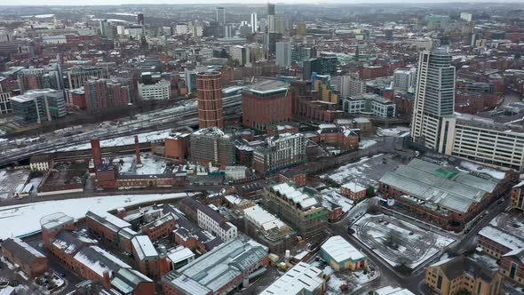 Aerial footage of a snowy winters day in the city of Leeds in the UK