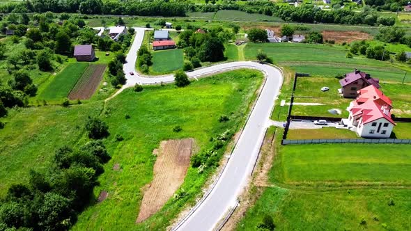 Aerial drone view of a flying over the rural agricultural landscape.