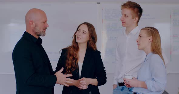 Group of Business People Discussing in Office