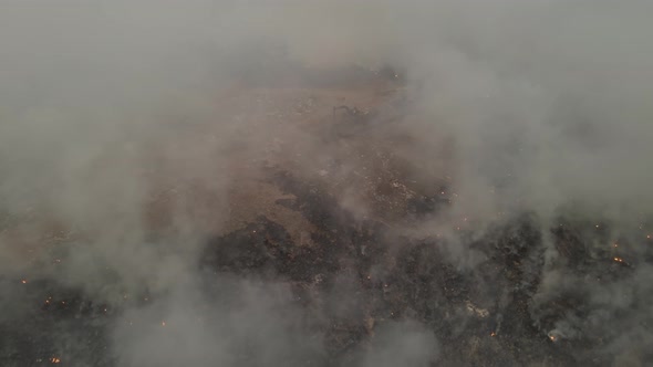 Garbage landfill peatland on fire