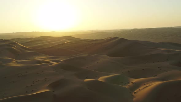 Aerial view of Dubai desert at sunset, United Arab Emirates.
