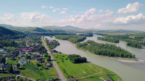 Aerial Shot Top View of the Tourist City Mountains Pine and Deciduous Forest Mountain River