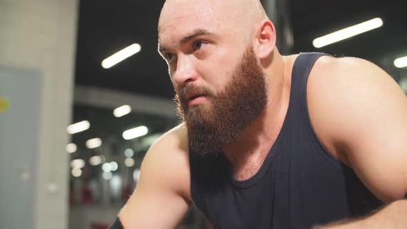 Portrait of Strong Bald Sportsman