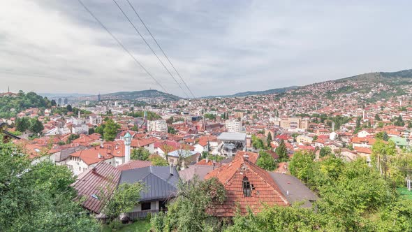 City panorama with cable car moving up and down from Sarajevo station to mountains