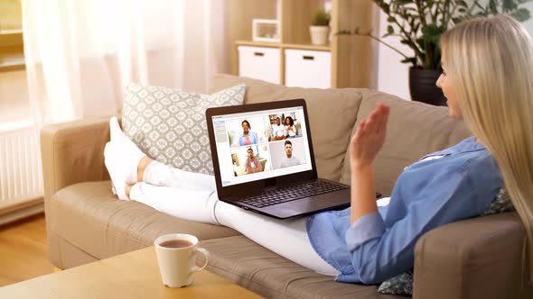 Woman Having Video Chat with Her Friends on Laptop