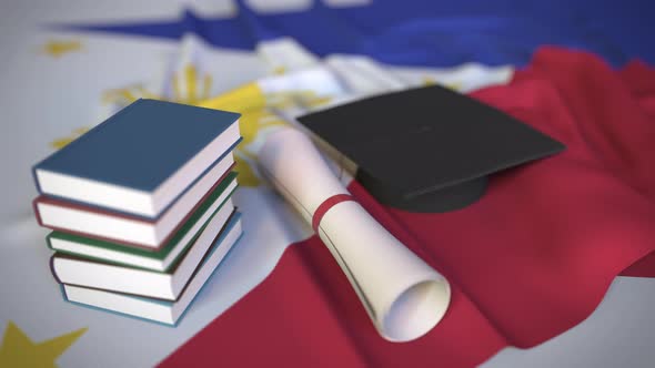 Graduation Cap and Diploma on Flag of the Philippines
