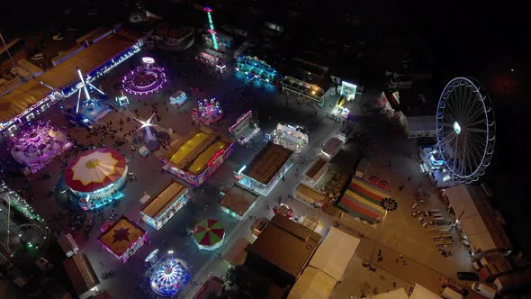 The Colorful Night Lights Of A Public Funfair During The Night - Wide Shot