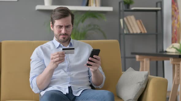 Young Man Unsuccessful Online Payment on Smartphone
