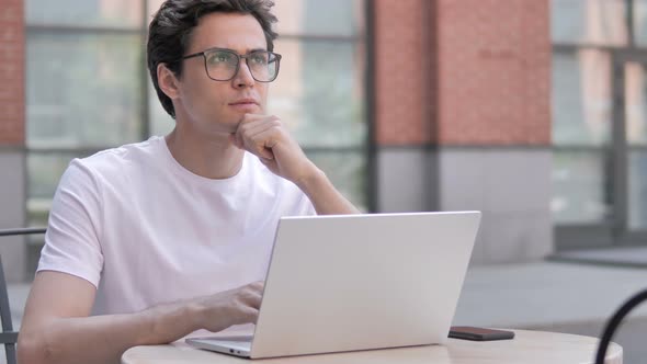 Man Thinking and Working on Laptop, Outdoor