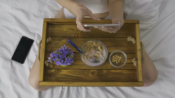 Woman Using Tablet During Breakfast