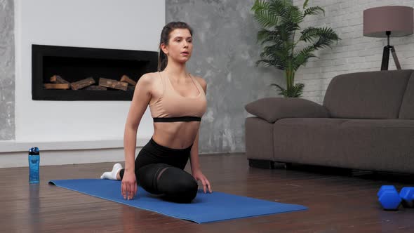 Fit Woman in Sportswear Does Sports Exercises on Fitness or Yoga Mat at Home