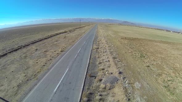 Aerial view of an empty desert road