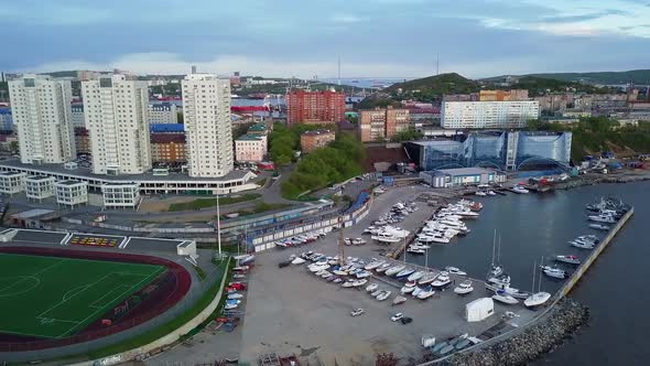 Drone View of the City and Marina Located on the Peninsula at Sunset