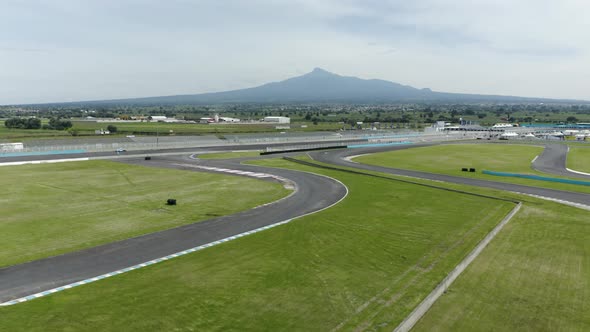 Fly over racetrack. Aerial view above Miguel E. Abed AIMA racing track driving sports