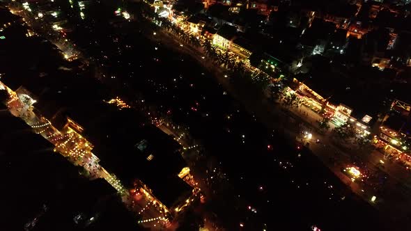 Aerial view of Hoi An ancient town at night with many lanterns.