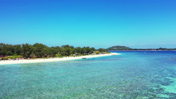 tropical White sand beach, palms and azure ocean with one moored boats, Bali