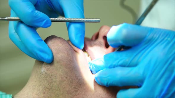 Dentist Examining A Patient