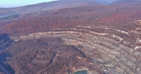 Large Quarry for Mining with a Finished Product Crushed Stone in the Foreground Top View Panorama