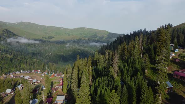 Misty Aerial View Of High Mountain Village