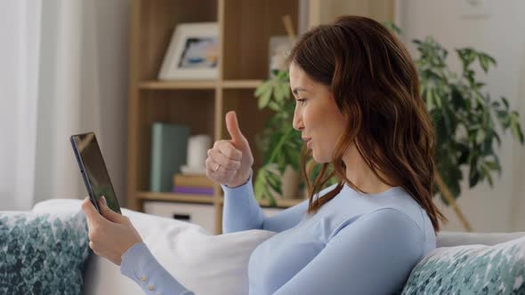 Woman Having Video Call on Tablet Pc at Home