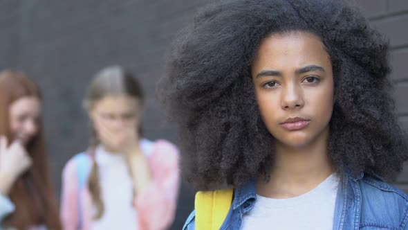 Portrait of Bullied Biracial Girl, Classmates Mocking Behind, Racism Awareness