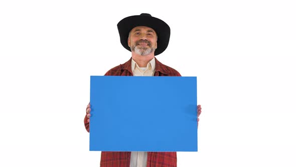 Smiling Senior Man in a Hat Holding Blank Placard on White Background