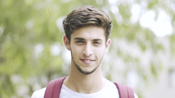 Portrait of teenage boy standing outdoors