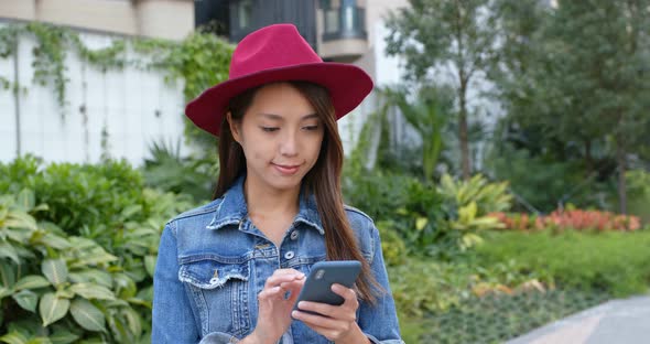 Woman use of mobile phone at outdoor