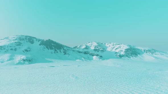 Snowed Mountains in Alaska with Fog