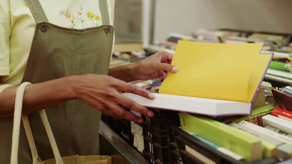 Close-up of woman shopping for books