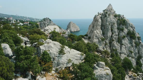 Aerial Fly Behind Rock Krylo Lebedya  Swan Wing with Diva Rock and Black Sea in Background