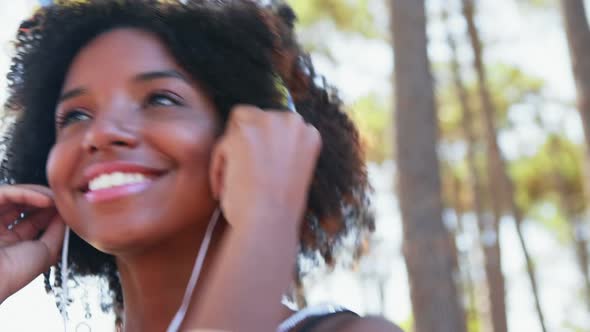 Woman listening to headphones 4k