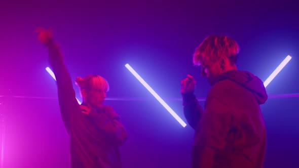 Two Hiphop Dancers Battling in Nightclub Stage Closeup