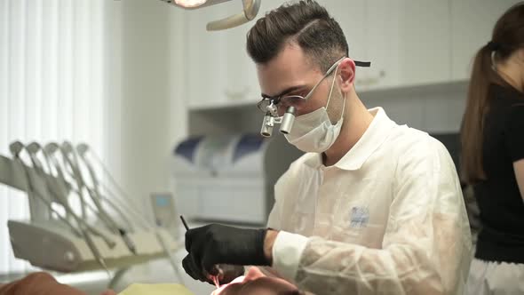 Slow motion of a dentist working in a dental clinic