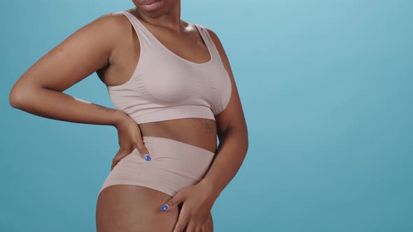 Studio Portrait of Plus Size African American Woman in Underwear