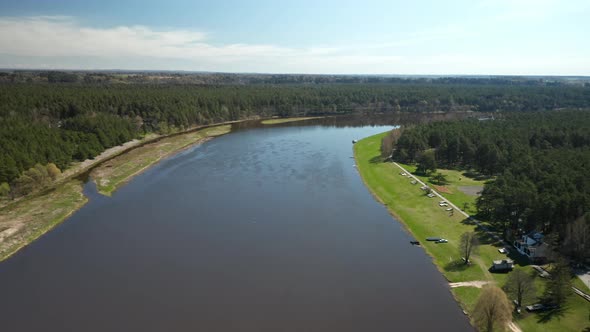 AERIAL: Wide River Nemunas on a Sunny Day in Birstonas