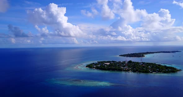 Tropical birds eye abstract view of a white paradise beach and aqua blue ocean background 