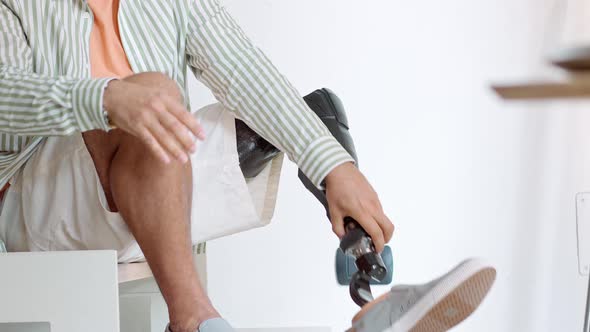 Amputee Man with Above Knee Leg Prosthesis Standing on Feet Close Up