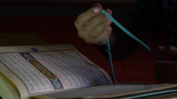 Reading Quran and Pray Rosary