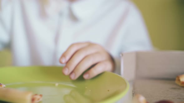 Student in Glasses Has Dinner with Fresh Pizza at Table