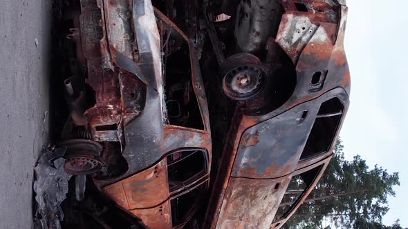 Vertical Video Irpin Bucha District  Destroyed Cars During the War in Ukraine