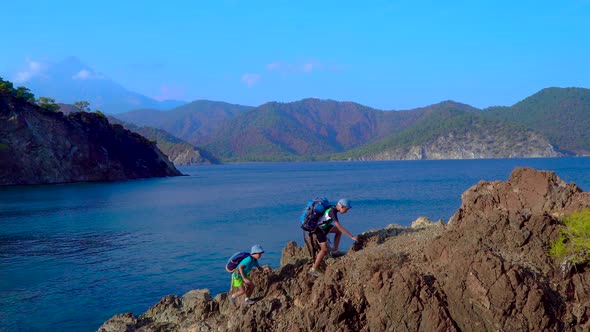 Children Traveler with Backpacks in the Mountain