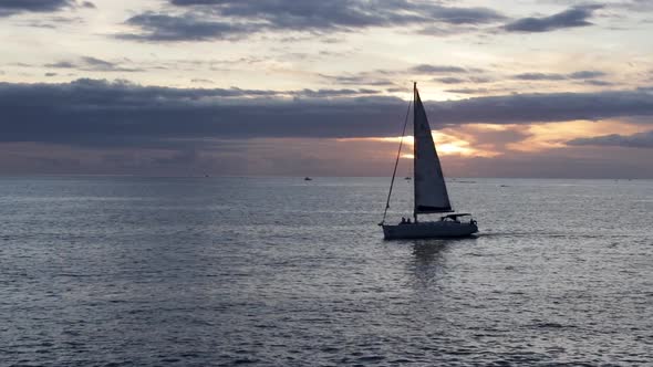 Sailing yacht in the ocean at sunset, Tenerife