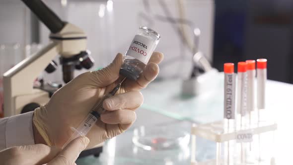 Bottle Vial Vaccine and Syringe Injection Closeup