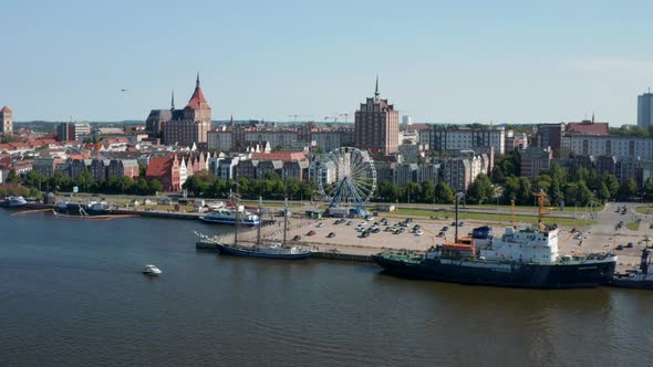 Slide and Pan Footage of Ships at Waterfront in City