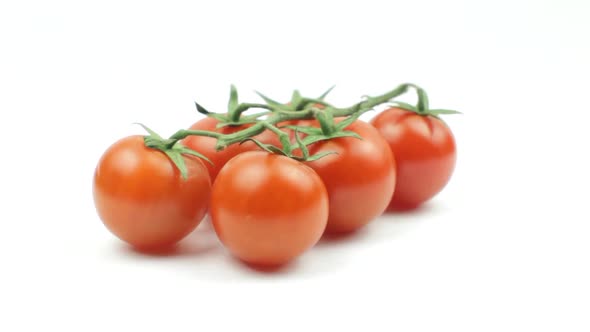 Cherry Tomatoes Rotating On White