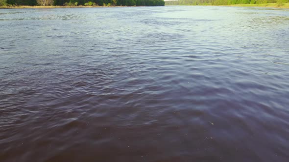 Wide River Closeup Green Grass Horizon Forest Aerial View