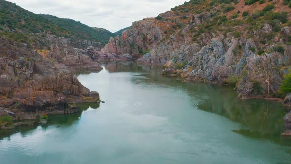 Aerial View of the Mountain River Near Mertola