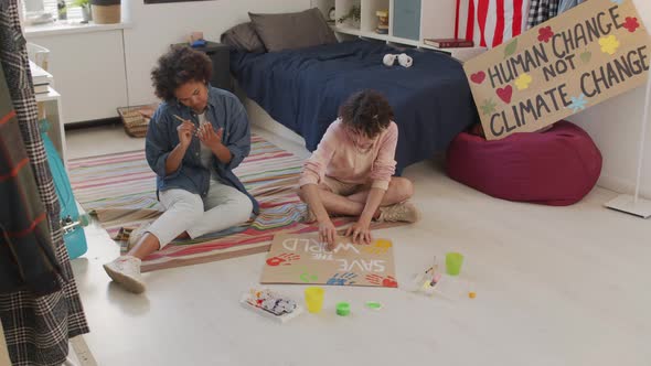 Two Friends Making Activist Signs